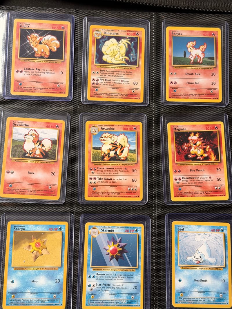A binder page of Base Set cards, each in a toploader
