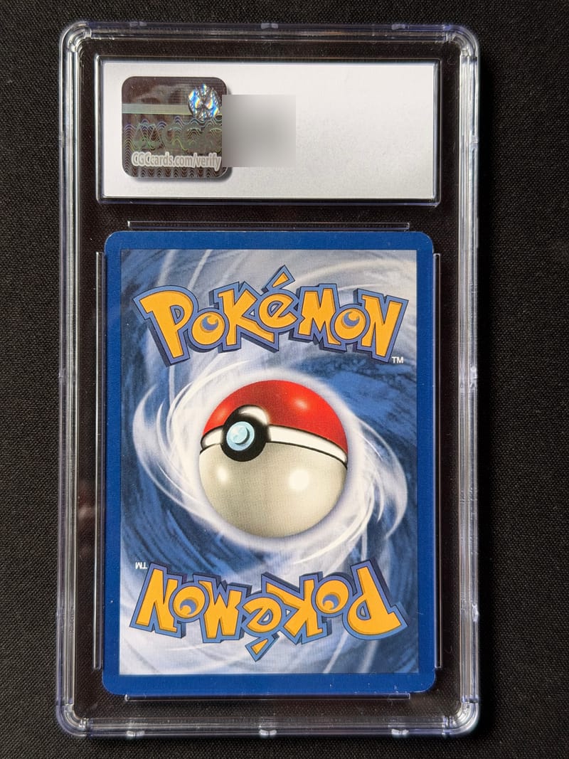 The back of a CGC slab, with the hologram sticker, and the QR code area blurred