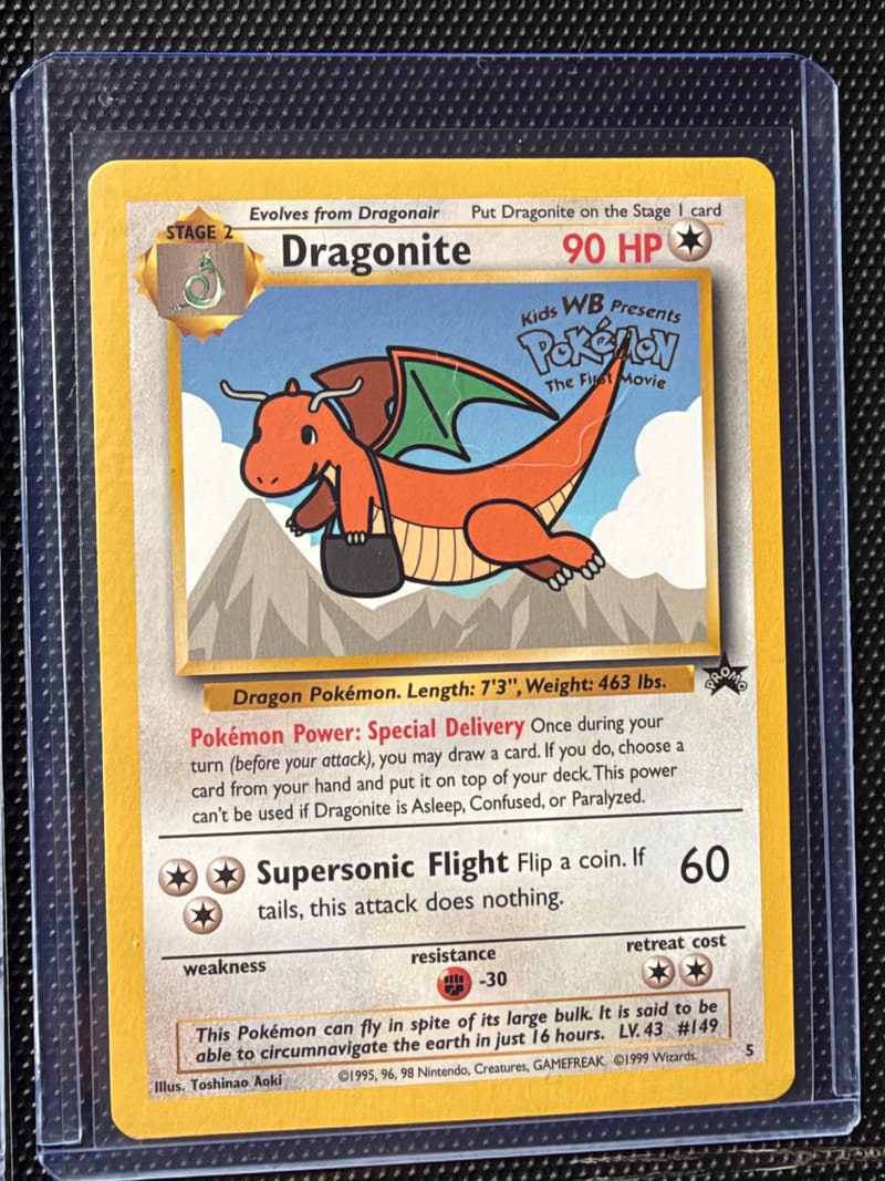 A Wizards Black Star promo Dragonite numbered 5, with the PROMO star at the right end of the bar under the art